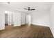 Bedroom with wood-look floors and a door leading to an ensuite bathroom at 2254 Lisbon Ln, Jonesboro, GA 30236