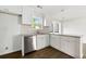 Kitchen area featuring stainless steel dishwasher and stylish backsplash at 2254 Lisbon Ln, Jonesboro, GA 30236