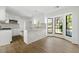 Bright kitchen with granite countertops, white cabinets, and bay window seating area at 2254 Lisbon Ln, Jonesboro, GA 30236