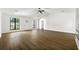 Spacious living room with modern fireplace, ceiling fan, and hardwood floors at 2254 Lisbon Ln, Jonesboro, GA 30236