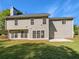 Expansive backyard with plenty of green space and a view of the home's rear elevation at 4269 David Austin Ct, Snellville, GA 30039