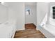 Bathroom featuring double sinks, a soaking tub and laminate floors at 4269 David Austin Ct, Snellville, GA 30039