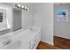 Bright bathroom with a double sink vanity, tub, and ample natural light at 4269 David Austin Ct, Snellville, GA 30039