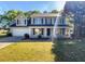 Charming two-story home with manicured lawn, mature trees and an attached garage at 4269 David Austin Ct, Snellville, GA 30039