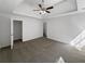 Bright and airy main bedroom with a tray ceiling and plush carpeting at 4269 David Austin Ct, Snellville, GA 30039