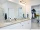 Modern bathroom featuring double sinks, granite countertops, and glass-enclosed shower at 475 Mcdonough Rd, Fayetteville, GA 30214