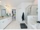 Bathroom featuring double sinks, granite countertops, and glass-enclosed shower at 475 Mcdonough Rd, Fayetteville, GA 30214