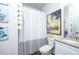 Well-lit bathroom features a shower-tub combination with a linen closet, a granite vanity, and decorative accents at 475 Mcdonough Rd, Fayetteville, GA 30214
