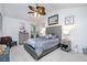 Cozy bedroom with vaulted ceiling, a ceiling fan, tufted headboard and neutral colors at 475 Mcdonough Rd, Fayetteville, GA 30214
