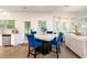 Cozy dining area is bathed in natural light, seamlessly connecting the kitchen and living spaces for easy entertaining at 475 Mcdonough Rd, Fayetteville, GA 30214