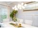 Bright and airy dining area featuring a modern light fixture, large table, and stylish decor for entertaining guests at 475 Mcdonough Rd, Fayetteville, GA 30214