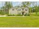 Charming two-story home with brick and stone exterior and a well-manicured lawn at 475 Mcdonough Rd, Fayetteville, GA 30214
