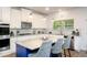 Gourmet eat-in kitchen featuring granite countertops, stainless steel appliances, and a large island perfect for entertaining at 475 Mcdonough Rd, Fayetteville, GA 30214