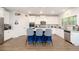Eat-in kitchen boasts a large island with counter seating, granite countertops, stainless steel appliances, and ample cabinet space at 475 Mcdonough Rd, Fayetteville, GA 30214