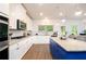 Gourmet kitchen boasts granite countertops, stainless steel appliances, and ample cabinet space with a cozy breakfast nook at 475 Mcdonough Rd, Fayetteville, GA 30214