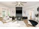An open-concept living room featuring modern fireplace, sleek furniture, and plenty of natural light at 475 Mcdonough Rd, Fayetteville, GA 30214