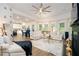 Bright and airy living room featuring a fireplace, stylish furniture, and large windows offering scenic views at 475 Mcdonough Rd, Fayetteville, GA 30214