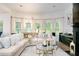 Cozy living room area showcasing a comfortable sofa and fireplace, creating a warm and inviting space at 475 Mcdonough Rd, Fayetteville, GA 30214