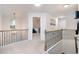 Bright upstairs hallway with railing overlooks the main entry and provides access to the bedrooms and common areas at 475 Mcdonough Rd, Fayetteville, GA 30214