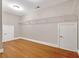 A spacious walk-in closet with hardwood floors and adjustable shelving for optimal storage at 621 Champions Dr, Mcdonough, GA 30253