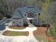 Stately home with beautiful landscaping and a circular driveway leading to the columned front entrance at 621 Champions Dr, Mcdonough, GA 30253