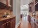 Well-appointed kitchen with sleek countertops, custom cabinets, and open layout to living spaces at 621 Champions Dr, Mcdonough, GA 30253