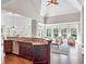 Bright and airy living space with large windows, vaulted ceilings, and an open kitchen at 621 Champions Dr, Mcdonough, GA 30253