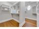 Walk-in closet with custom shelving and ample storage space at 621 Champions Dr, Mcdonough, GA 30253