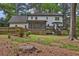 Expansive backyard featuring a deck, screened porch, and well-maintained lawn at 191 Gates Mill Dr, Lawrenceville, GA 30045