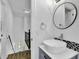 Modern bathroom features vessel sink, updated fixtures, and staircase at 191 Gates Mill Dr, Lawrenceville, GA 30045