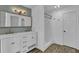 Bathroom with double sink vanity with a view of the shower and commode at 191 Gates Mill Dr, Lawrenceville, GA 30045