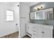 Beautiful bathroom with a double vanity, modern fixtures, and geometric wallpaper at 191 Gates Mill Dr, Lawrenceville, GA 30045