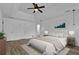 Spacious bedroom with hardwood floors, tray ceiling, ceiling fan, and neutral decor at 191 Gates Mill Dr, Lawrenceville, GA 30045