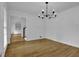 Formal dining area with hardwood floors and a classic hanging light fixture at 191 Gates Mill Dr, Lawrenceville, GA 30045