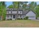 Charming two-story home with a welcoming front porch and a well-manicured lawn, perfect for suburban living at 191 Gates Mill Dr, Lawrenceville, GA 30045