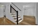 Bright foyer with hardwood floors and staircase to the second floor at 191 Gates Mill Dr, Lawrenceville, GA 30045