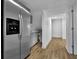 Modern kitchen featuring stainless steel appliances and bright white cabinetry at 191 Gates Mill Dr, Lawrenceville, GA 30045
