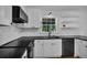 Updated kitchen features stainless steel appliances, sleek countertops, and modern cabinetry at 191 Gates Mill Dr, Lawrenceville, GA 30045