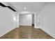 Bright living room featuring hardwood floors, shiplap walls, and recessed lighting at 191 Gates Mill Dr, Lawrenceville, GA 30045