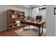 Office space featuring barn door, desk, bookshelves, and modern decor at 191 Gates Mill Dr, Lawrenceville, GA 30045