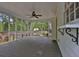 Screened-in porch providing an outdoor living space with a view of the backyard at 191 Gates Mill Dr, Lawrenceville, GA 30045