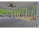 Spacious screened-in porch offering an outdoor living space with views of the backyard at 191 Gates Mill Dr, Lawrenceville, GA 30045