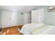 Bedroom featuring two closets and hardwood floors with a queen sized bed at 1919 Edinburgh Ne Ter, Atlanta, GA 30307