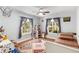 Bright bedroom with two windows, hardwood floors, and a playful decor with ample natural light at 1919 Edinburgh Ne Ter, Atlanta, GA 30307
