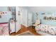 Comfortable bedroom featuring hardwood floors, decor and playful wall decorations at 1919 Edinburgh Ne Ter, Atlanta, GA 30307
