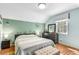 Relaxing bedroom with a window, queen sized bed, botanical wall art, and dresser at 1919 Edinburgh Ne Ter, Atlanta, GA 30307