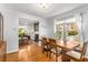 Dining room featuring hardwood floors, a modern table set, and an open view into the living room at 1919 Edinburgh Ne Ter, Atlanta, GA 30307
