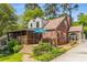 Charming brick home with a screened porch, wood deck, and beautiful landscaping, perfect for outdoor entertaining at 1919 Edinburgh Ne Ter, Atlanta, GA 30307