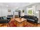 Elegant living room with hardwood floors, a comfortable leather sofa, and a decorative area rug at 1919 Edinburgh Ne Ter, Atlanta, GA 30307