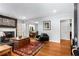 Inviting living room with a fireplace, hardwood floors, and an open layout into the dining area at 1919 Edinburgh Ne Ter, Atlanta, GA 30307